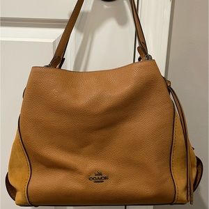 This COACH bag has never been used. Sat in a closet. Asking $100.